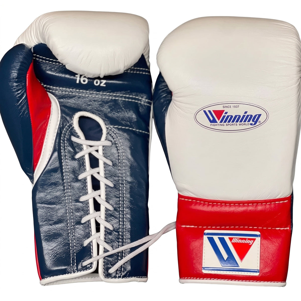 Winning white boxing gloves with a navy palm and red cuff, laced up at the wrist