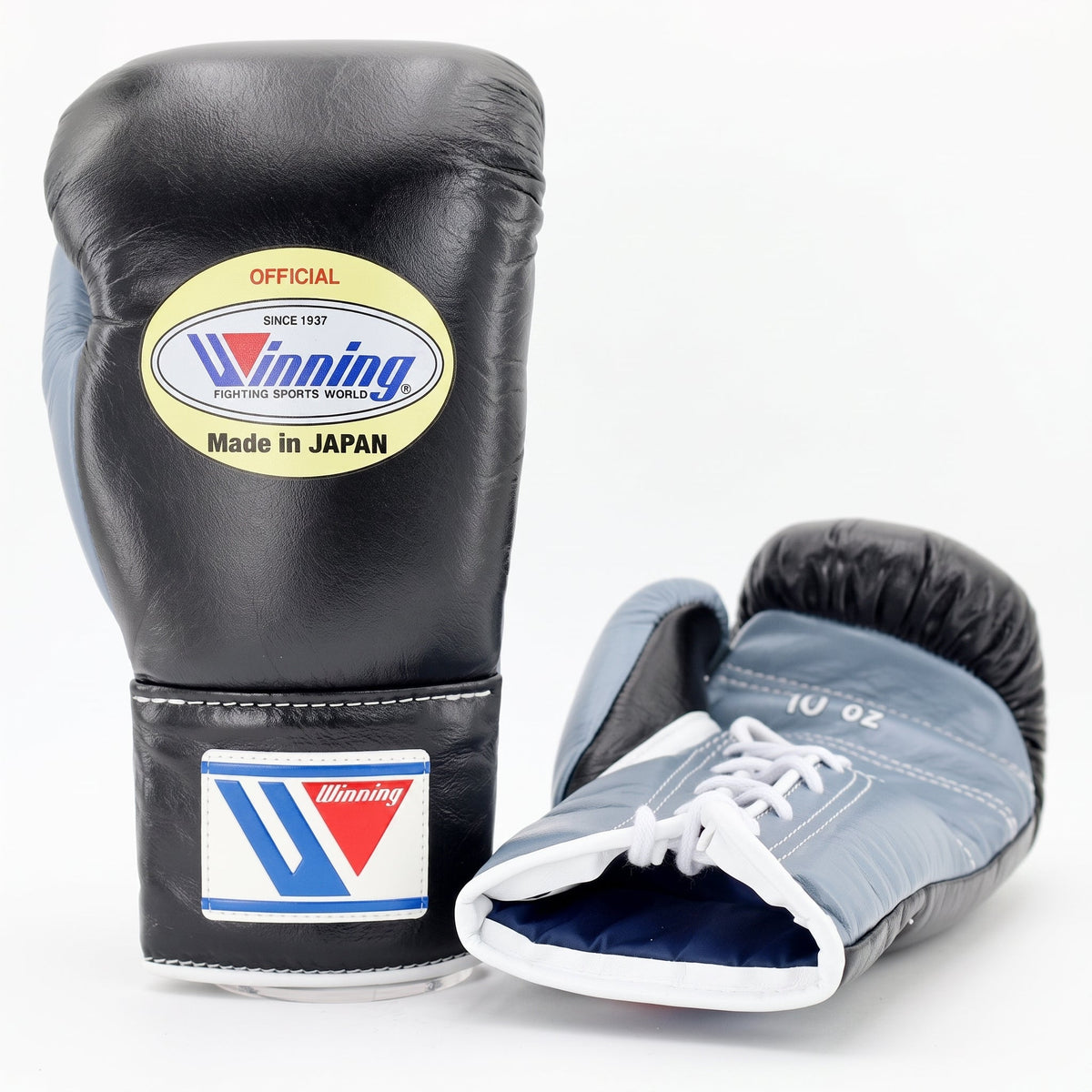 Winning black boxing gloves with silver-gray palm and black cuff and a lace-up wrist