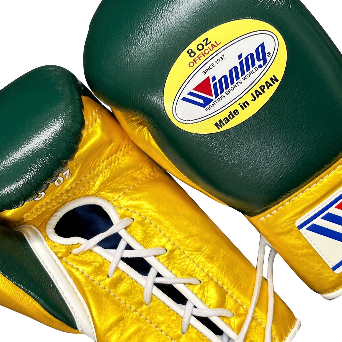 Winning dark green boxing gloves with metallic gold palm and gold cuff, laced at the wrist - side view