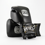 Cleto Reyes black leather boxing gloves side by side showing brand logo patches
