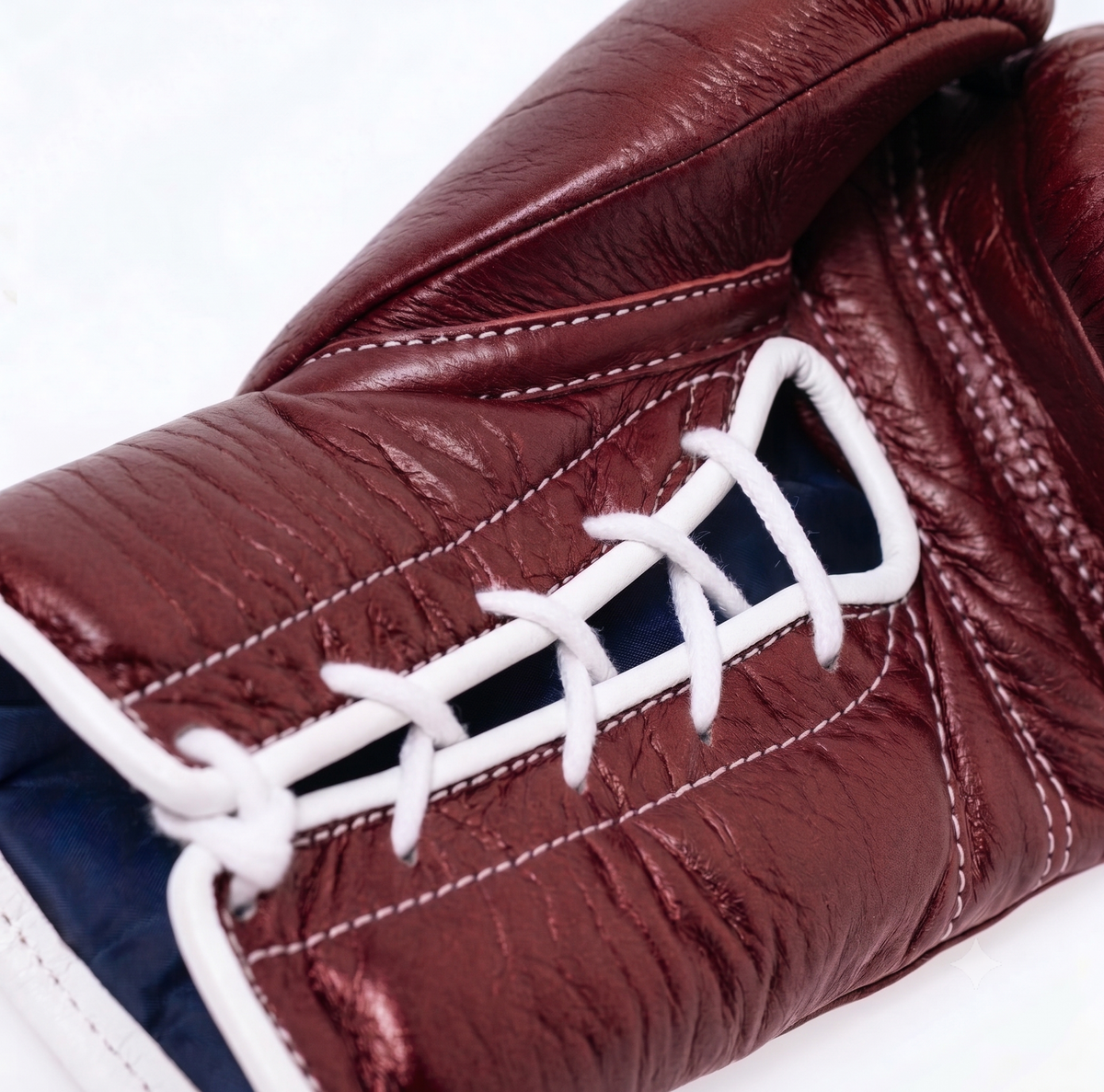 Winning MS-300 solid burgundy boxing gloves with white laces and red, white and blue W logo - side view