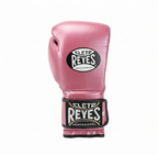 Single Cleto Reyes metallic pink leather boxing glove with brand logo on the black wrist strap