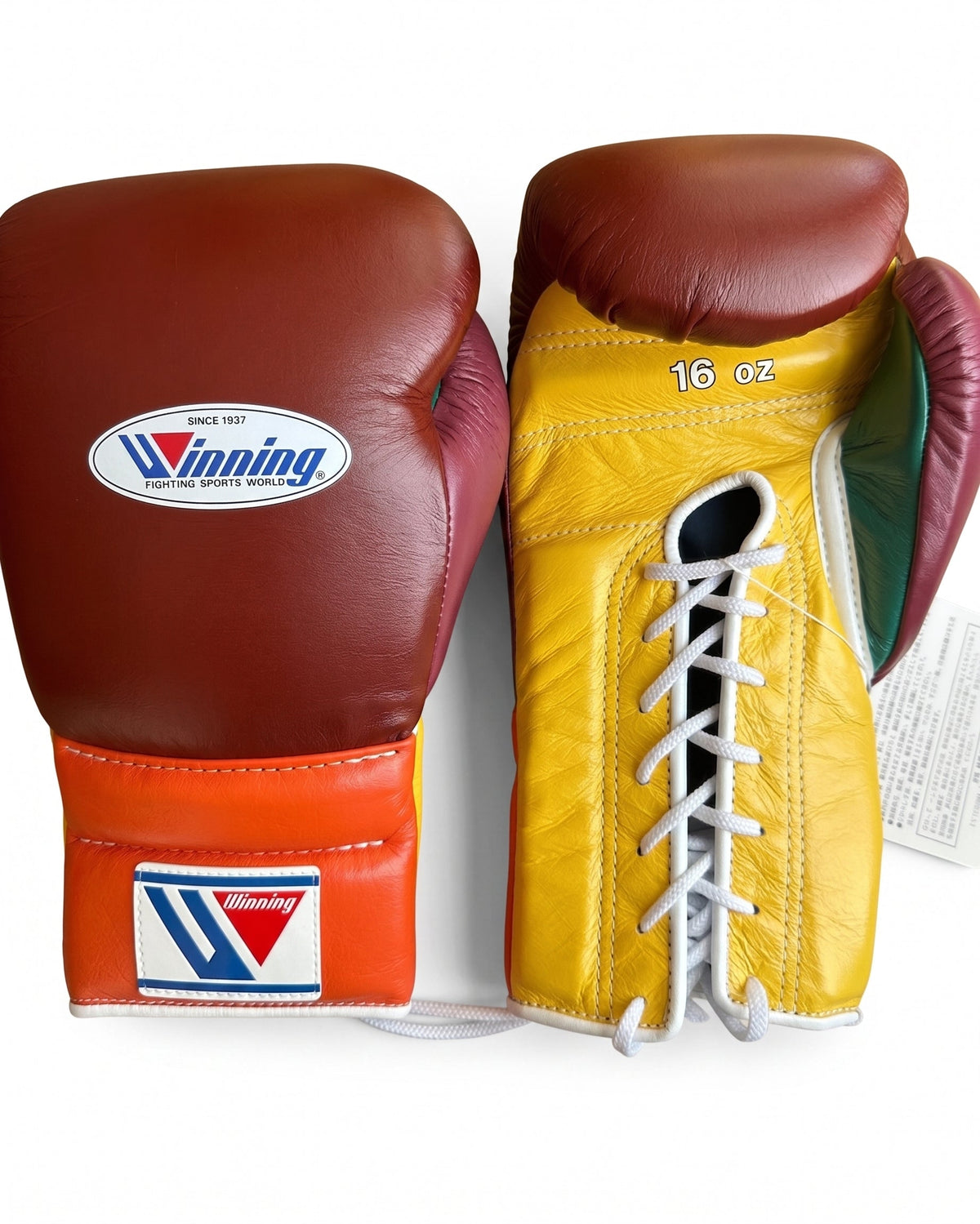 Winning lace-up boxing glove with brown leather back, yellow palm and orange cuff in a warm three-tone mix