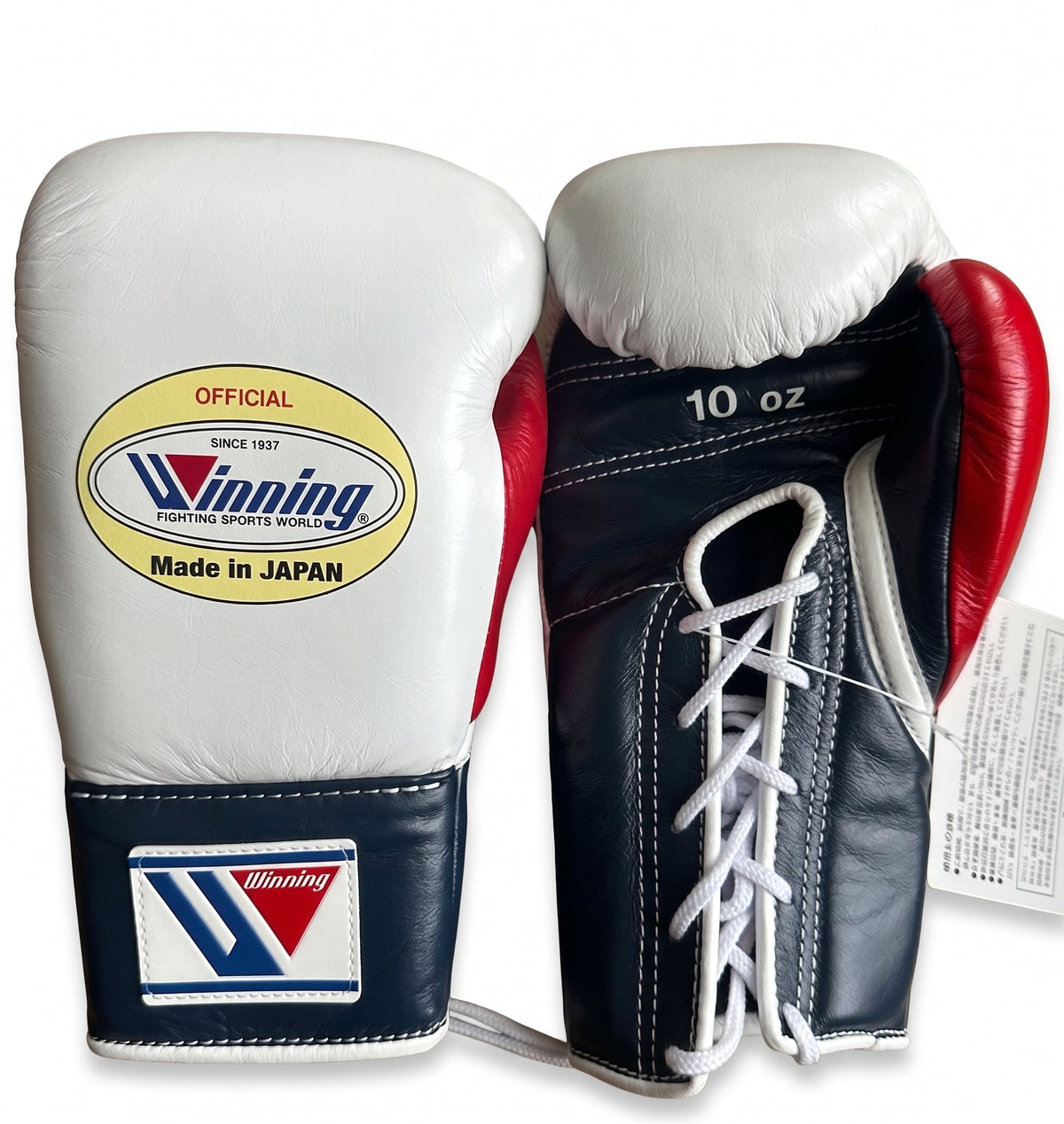 Winning lace-up boxing glove with white back, navy palm and cuff, and a red inner thumb in nautical colors