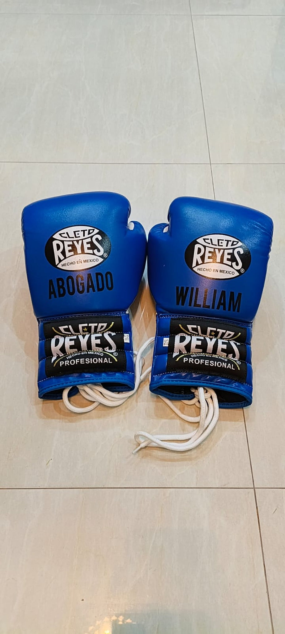 Front view of the royal blue Cleto Reyes cheek-protector headgear included in the set