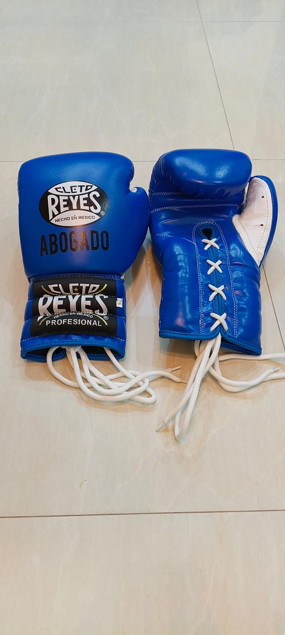 Side view of the royal blue Cleto Reyes headgear showing the cheek protection