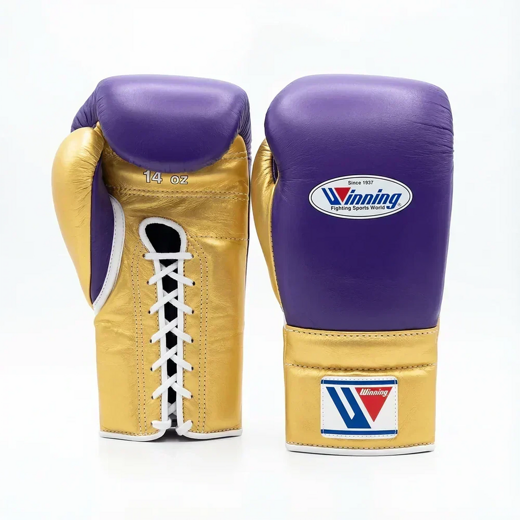 Winning lace-up boxing glove in purple leather with a gold cuff at the wrist - side view