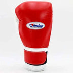 Winning MS-600-B Velcro boxing glove in red leather with a white hook-and-loop strap across the cuff - side view