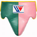 Winning groin guard with green and pink halves outlined by yellow piping around the edges and waistband
