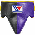 Winning groin guard split into black and purple halves with thin yellow piping along the edges