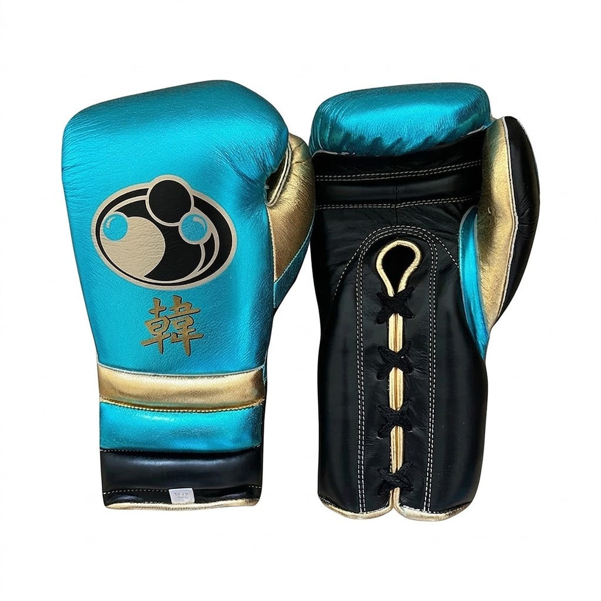 Grant metallic sky blue lace-up boxing gloves and matching headgear with gold accents and round Grant logo - side view