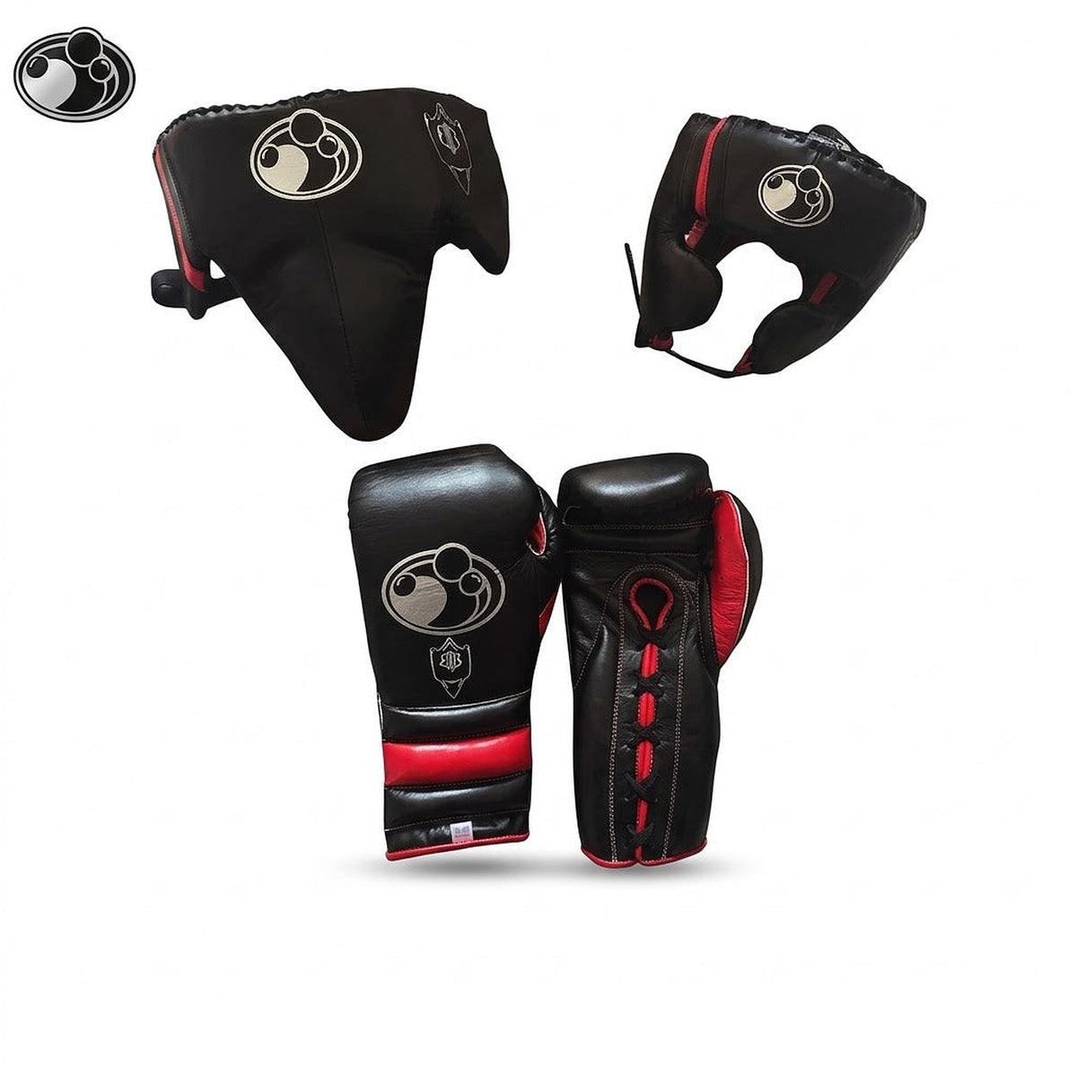 Grant black boxing set with red trim including lace-up gloves, headgear and groin guard laid out together