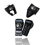 Grant all-black lace-up boxing gloves, black headgear and black groin guard laid out as a complete set