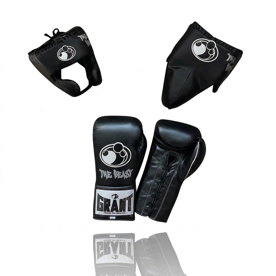 Grant all-black lace-up boxing gloves, black headgear and black groin guard laid out as a complete set