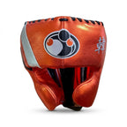 Grant metallic orange lace-up boxing gloves with silver cuffs alongside matching orange headgear - palm and closure detail