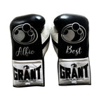 Grant black lace-up boxing gloves, headgear and groin guard with silver cuff patches and sample name prints - side view