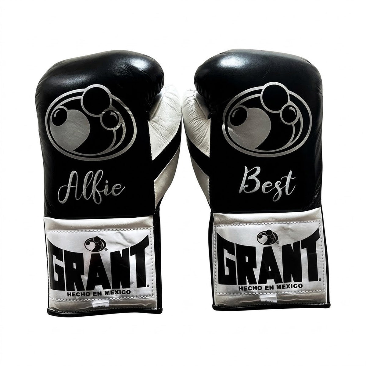 Grant black lace-up boxing gloves, headgear and groin guard with silver cuff patches and sample name prints - side view
