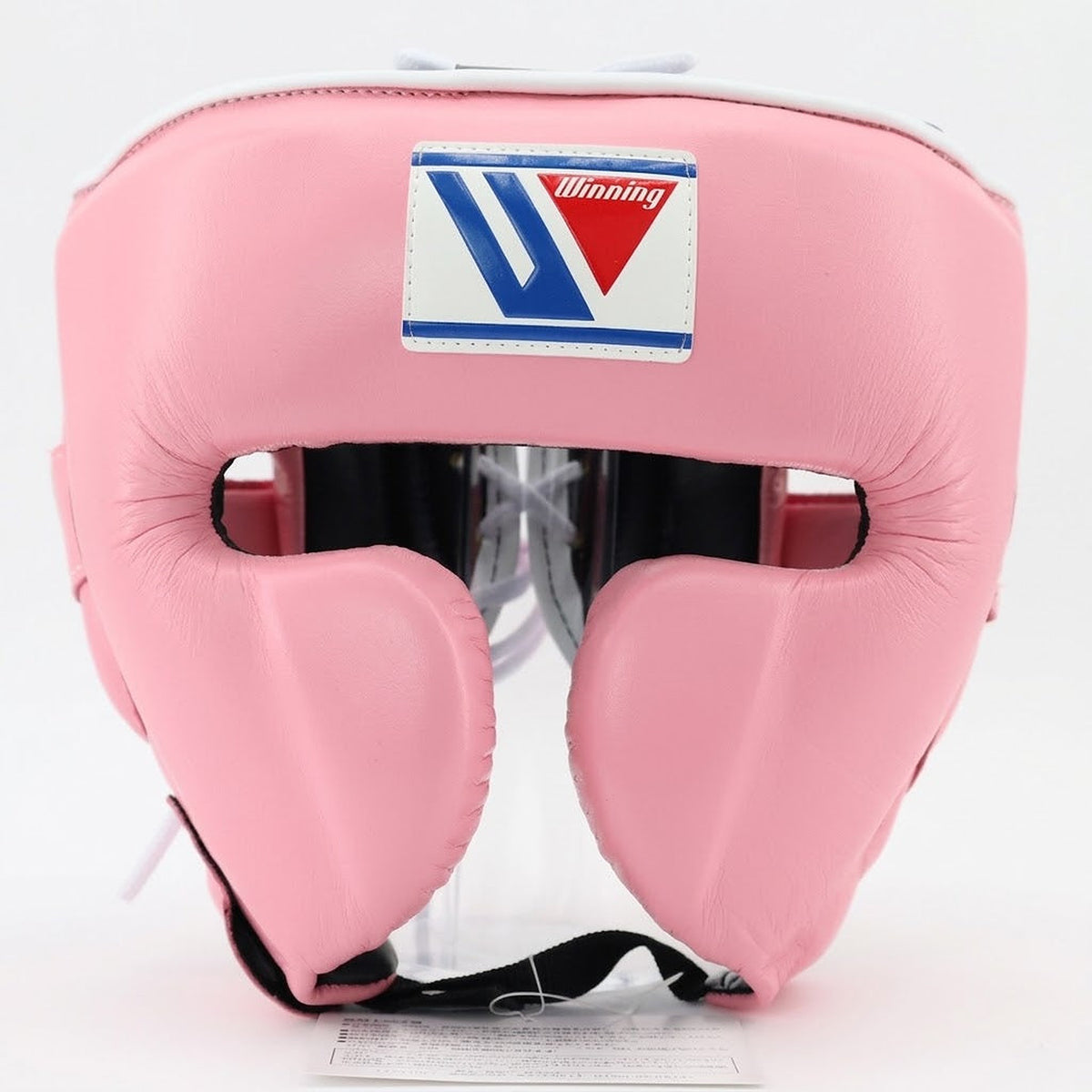 Winning cheek protector headgear in soft pastel baby pink with an open face, viewed from the front