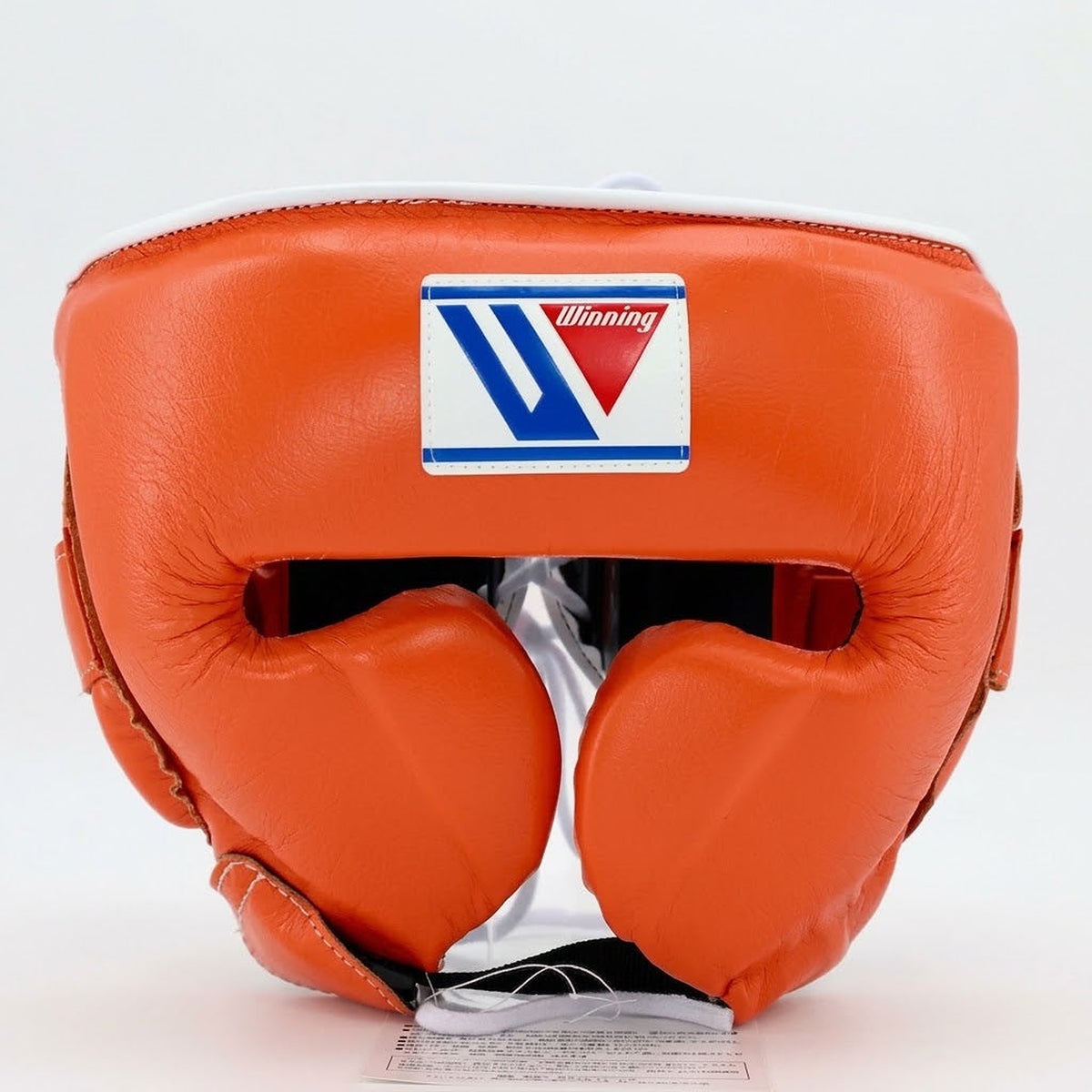 Winning boxing headgear in solid bright orange with padded cheek protectors and an open face front