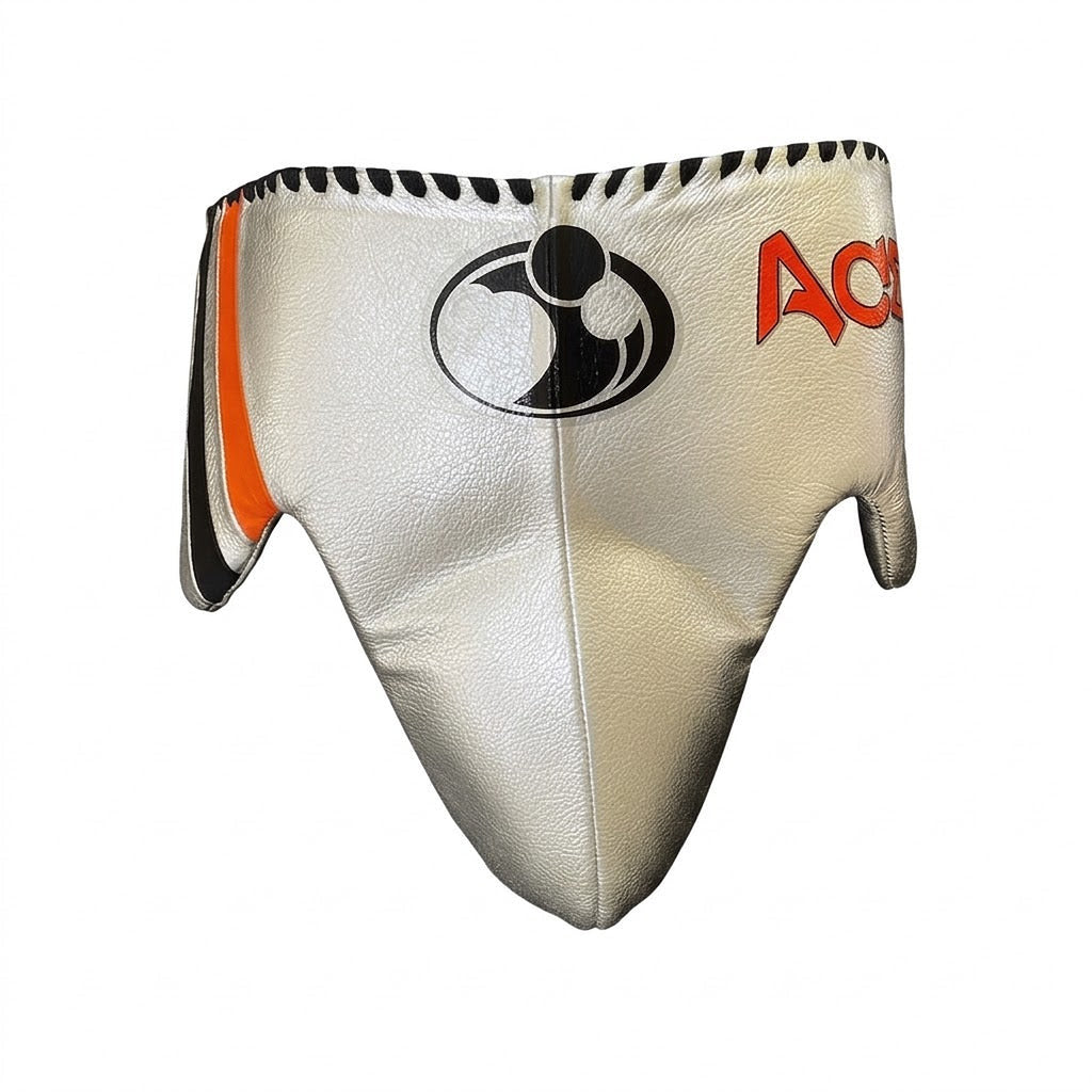 Grant white lace-up boxing gloves with black palms and orange trim, plus matching headgear - detail view