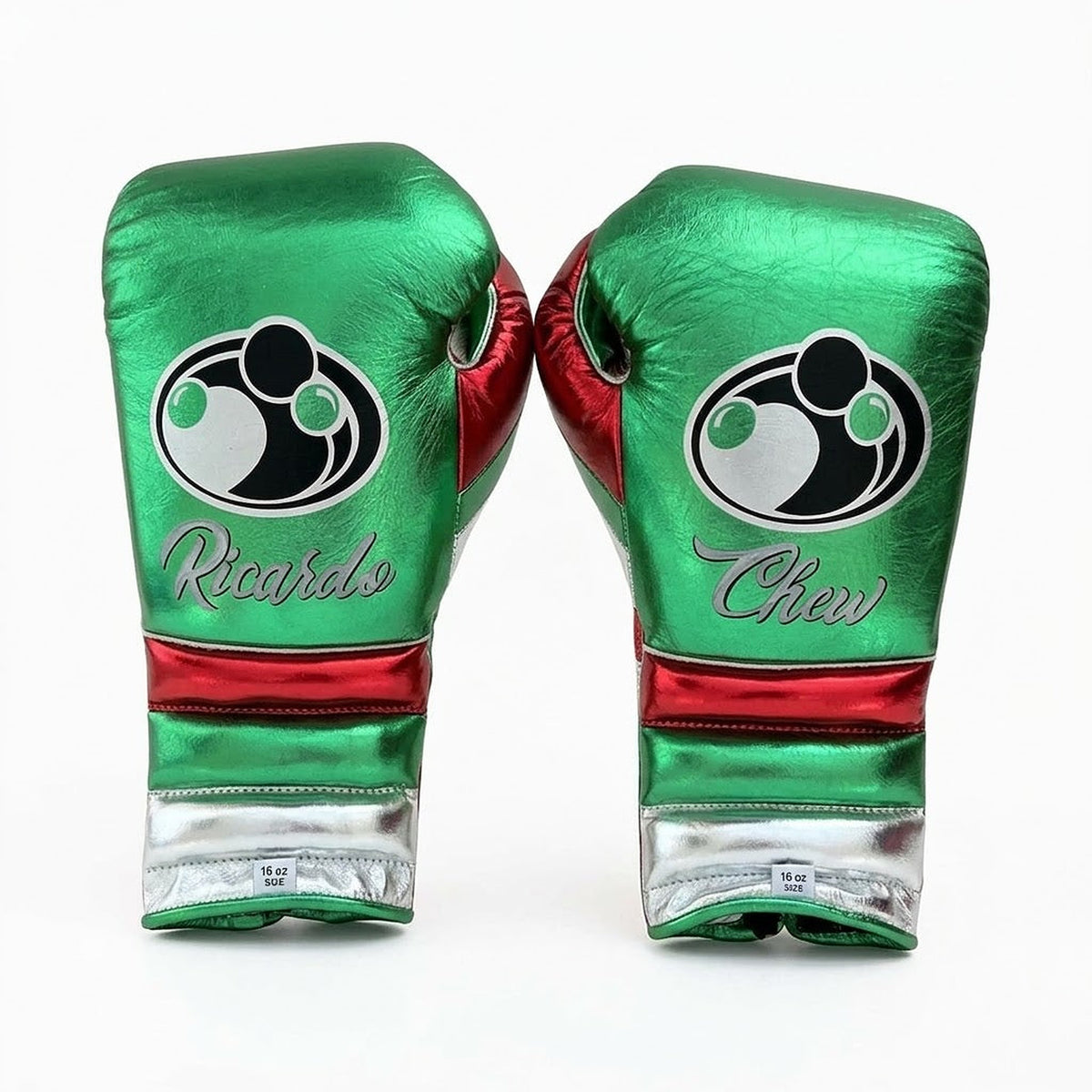 Grant metallic green lace-up boxing gloves and headgear with a red and white cuff band at the wrist - side view