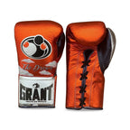 Grant metallic orange lace-up gloves with silver GRANT cuff patch, matching orange headgear and groin guard - side view