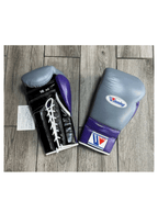 Winning MS-600 boxing glove with gray back, black palm and purple cuff, laced at the wrist - side view
