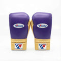 Winning lace-up boxing glove in purple leather with a gold cuff at the wrist