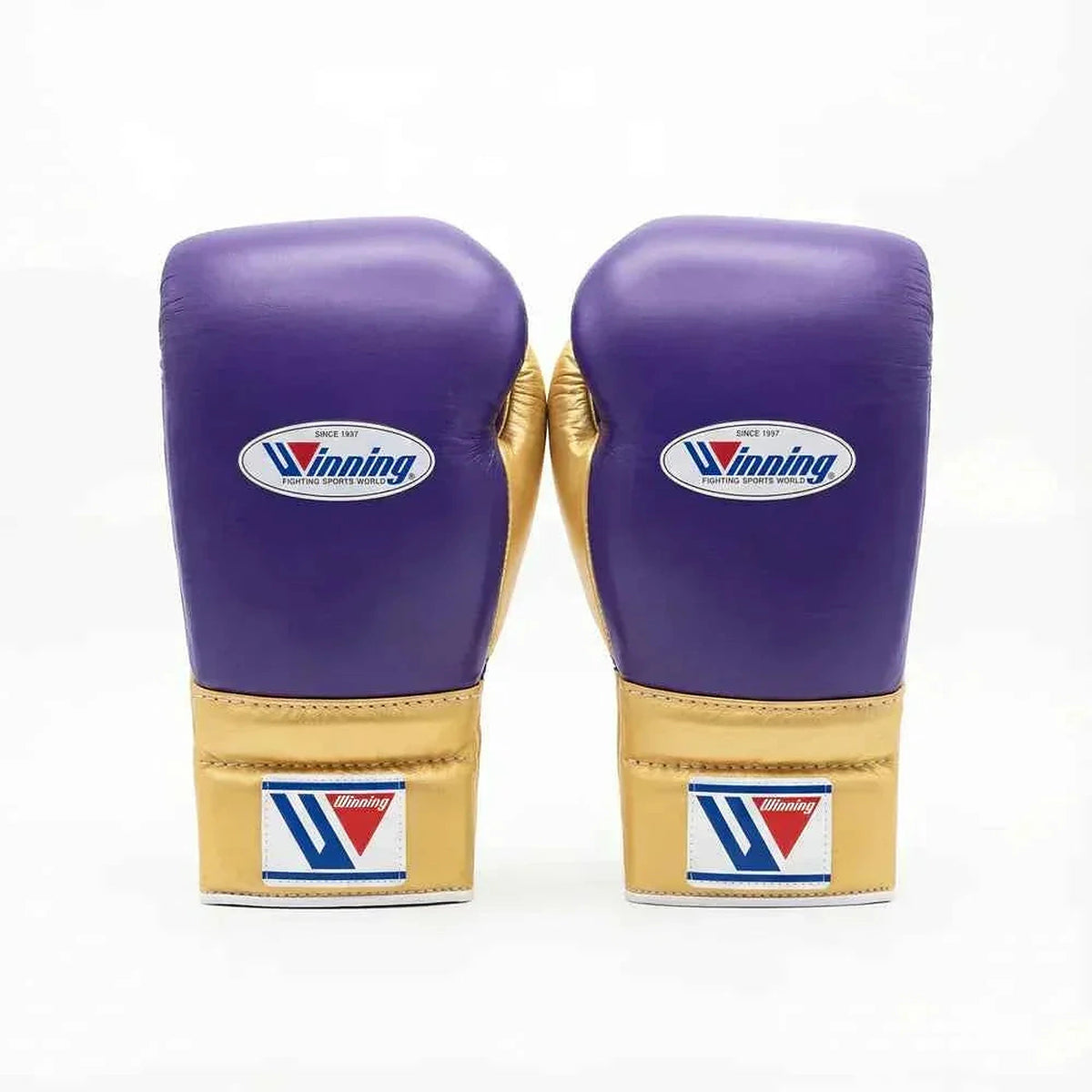 Winning lace-up boxing glove in purple leather with a gold cuff at the wrist