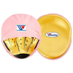 Winning pink curved focus mitts with shiny metallic gold grip on the palm side, shown as a matched pair - side view