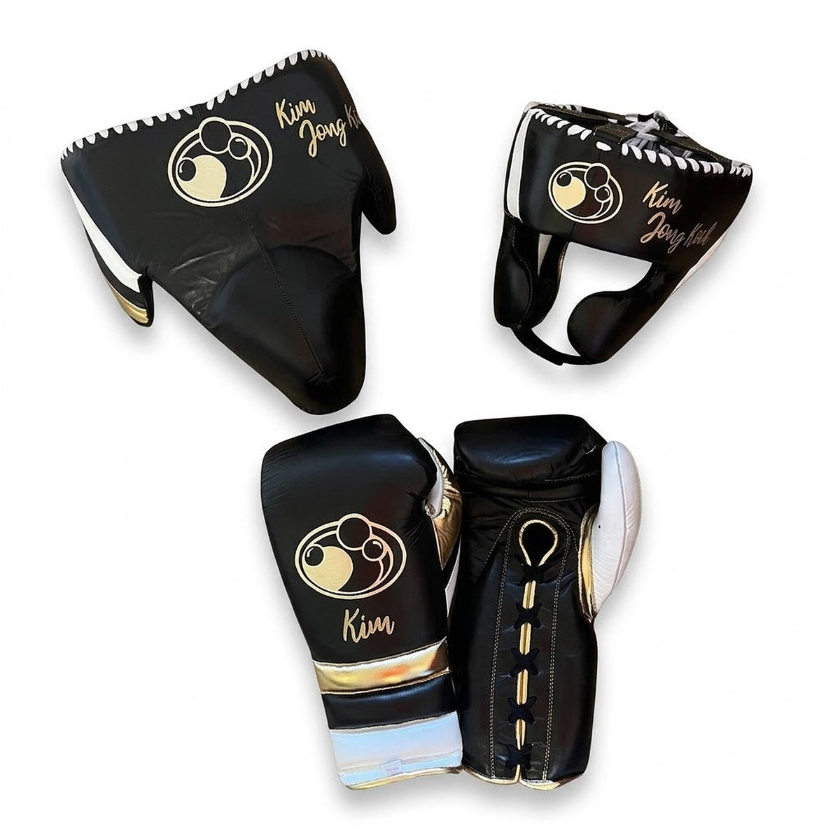Grant black lace-up boxing gloves with gold palms and white cuffs, plus matching headgear and groin guard